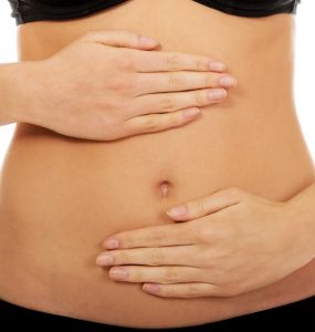 Close up of a woman's stomach to represent gut health