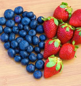 Blueberries and strawberries in a heart shape