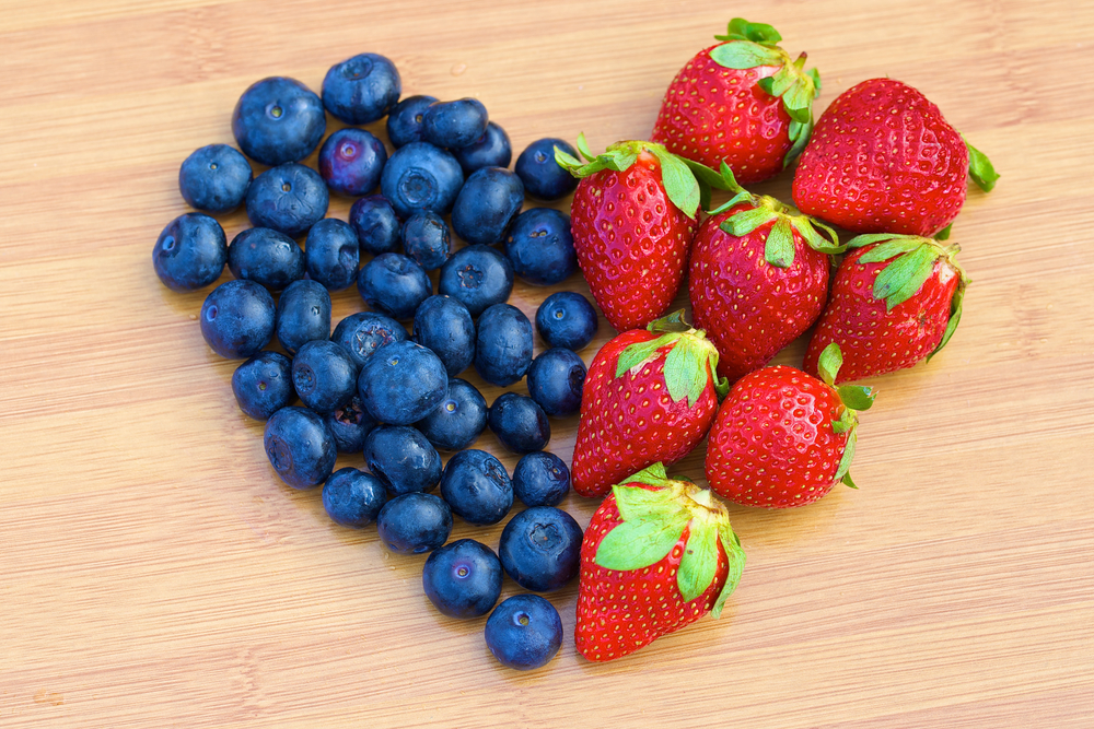 Blueberries and strawberries in a heart shape