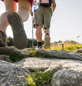 Close up of two hikers walking