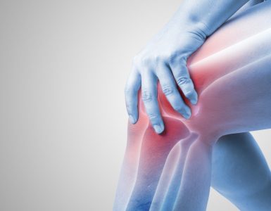 Close up of knee with glowing red showing joint pain