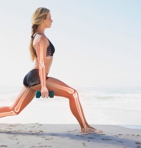 Woman lunging holding weights