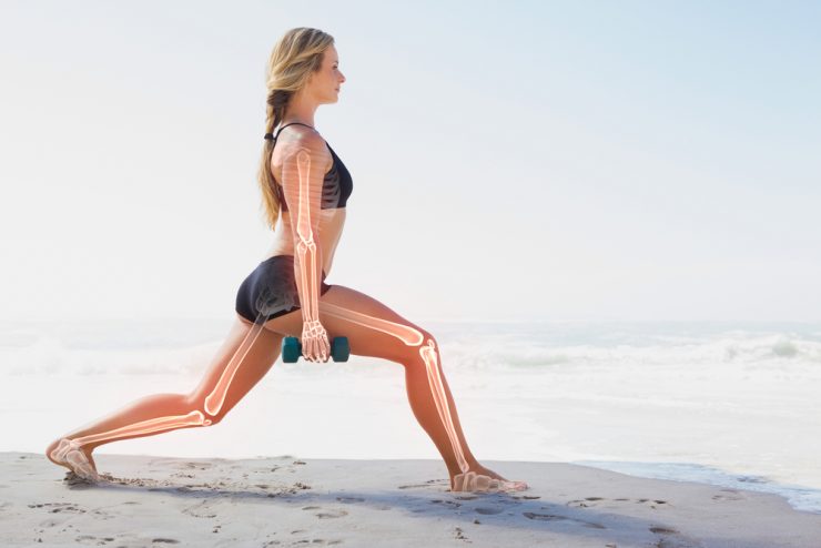 Woman lunging holding weights