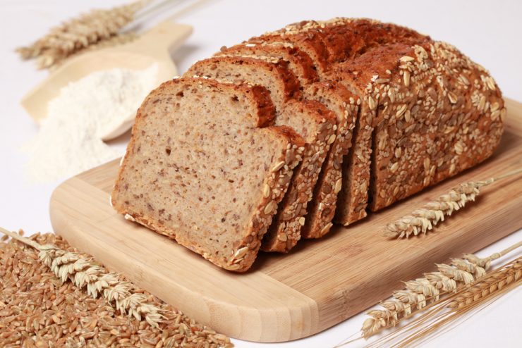 Wholewheat bread loaf with a scoop of flour