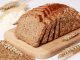 Wholewheat bread loaf with a scoop of flour