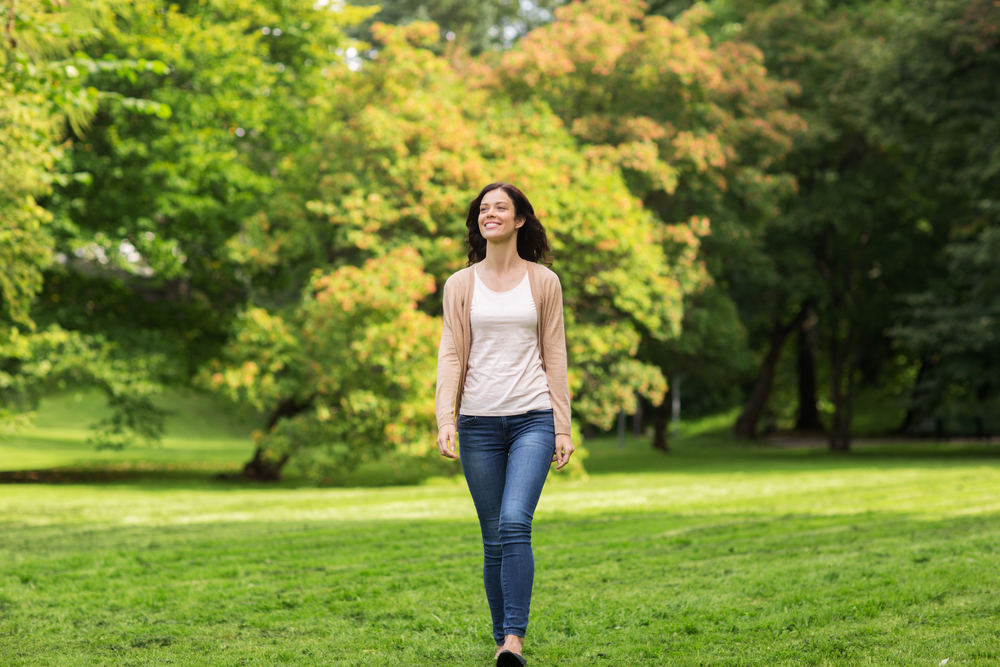 Woman walking in a park during her lunch break