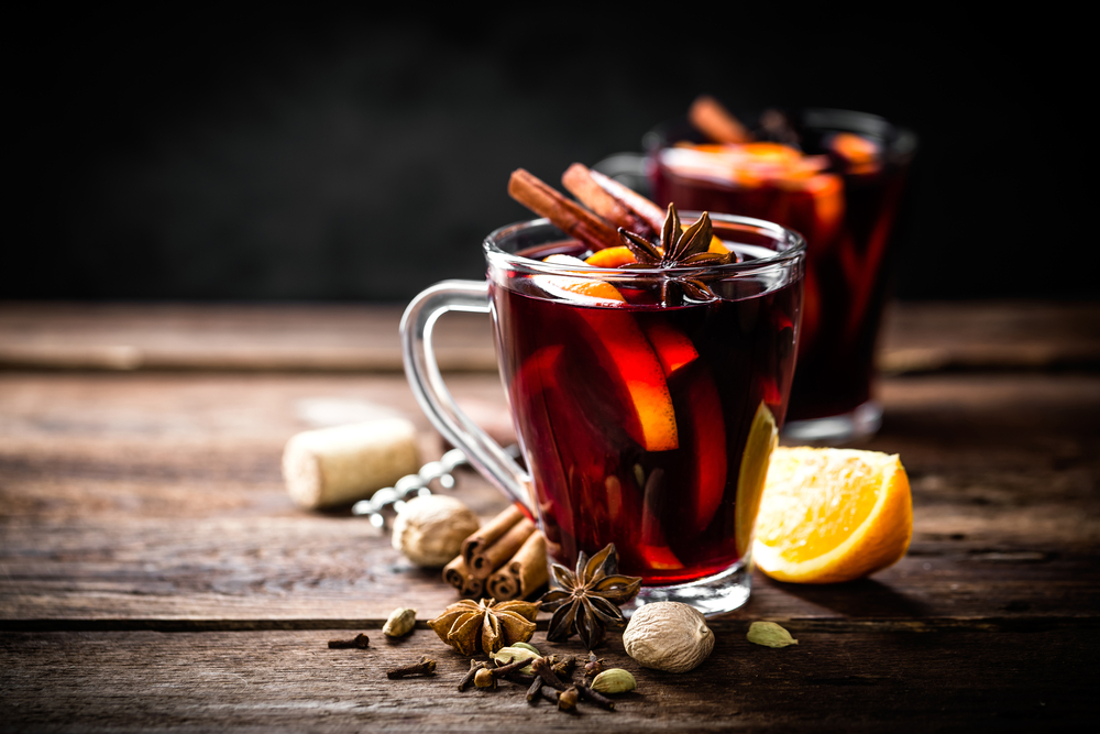 A glass of mulled wine with all the spices including nutmeg