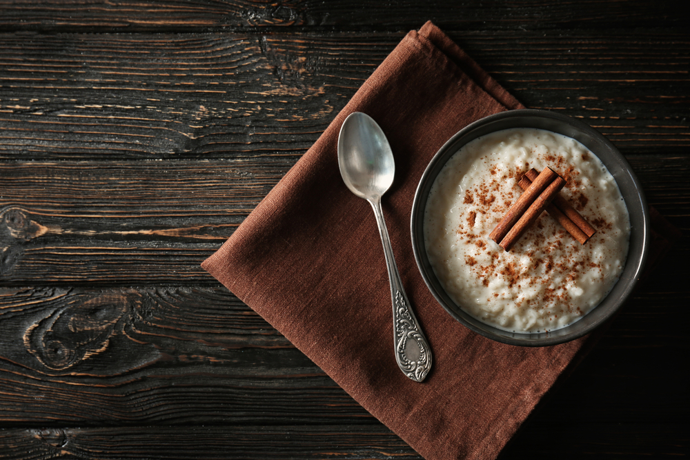 A bowl of porridge with cinnamon spinkled on top