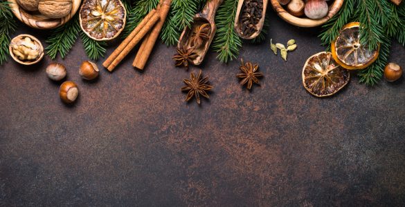 A range of christmas spices on a dark background