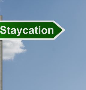 A road sign saying 'staycation'