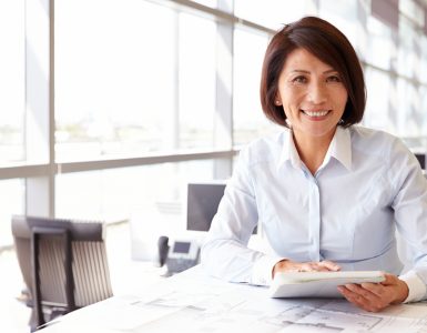 MIddle aged woman at work in office