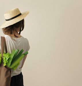 Woman with shopping bag of local produce