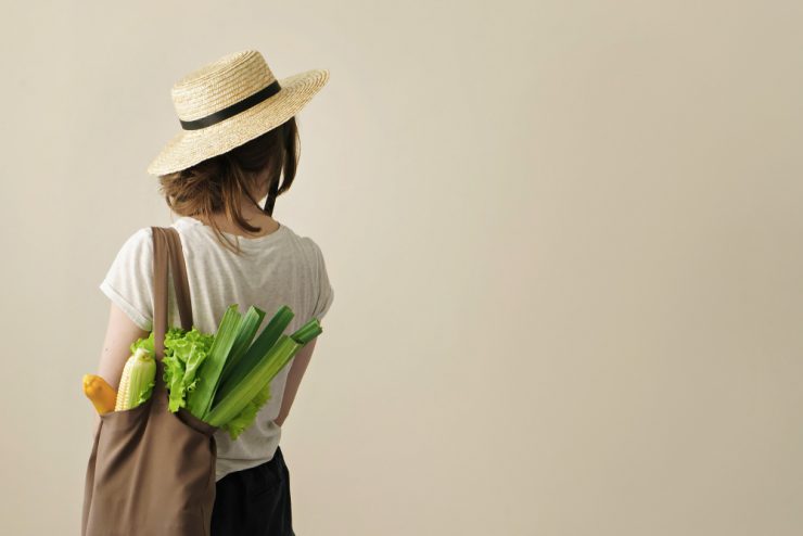 Woman with shopping bag of local produce