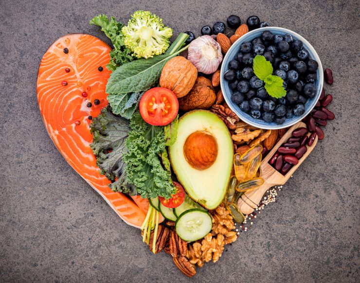 A group of heart healthy foods in a heart shape