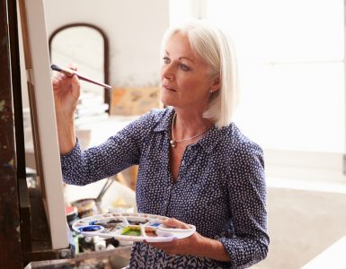 Middle aged woman painting
